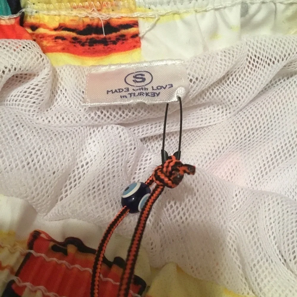 Spenglish tropical swim trunks.